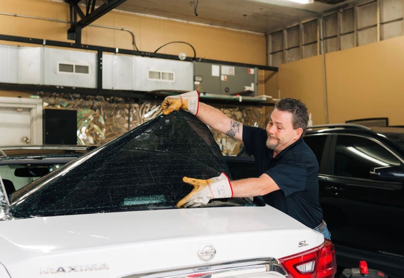 Auto glass being installed in a vehicle